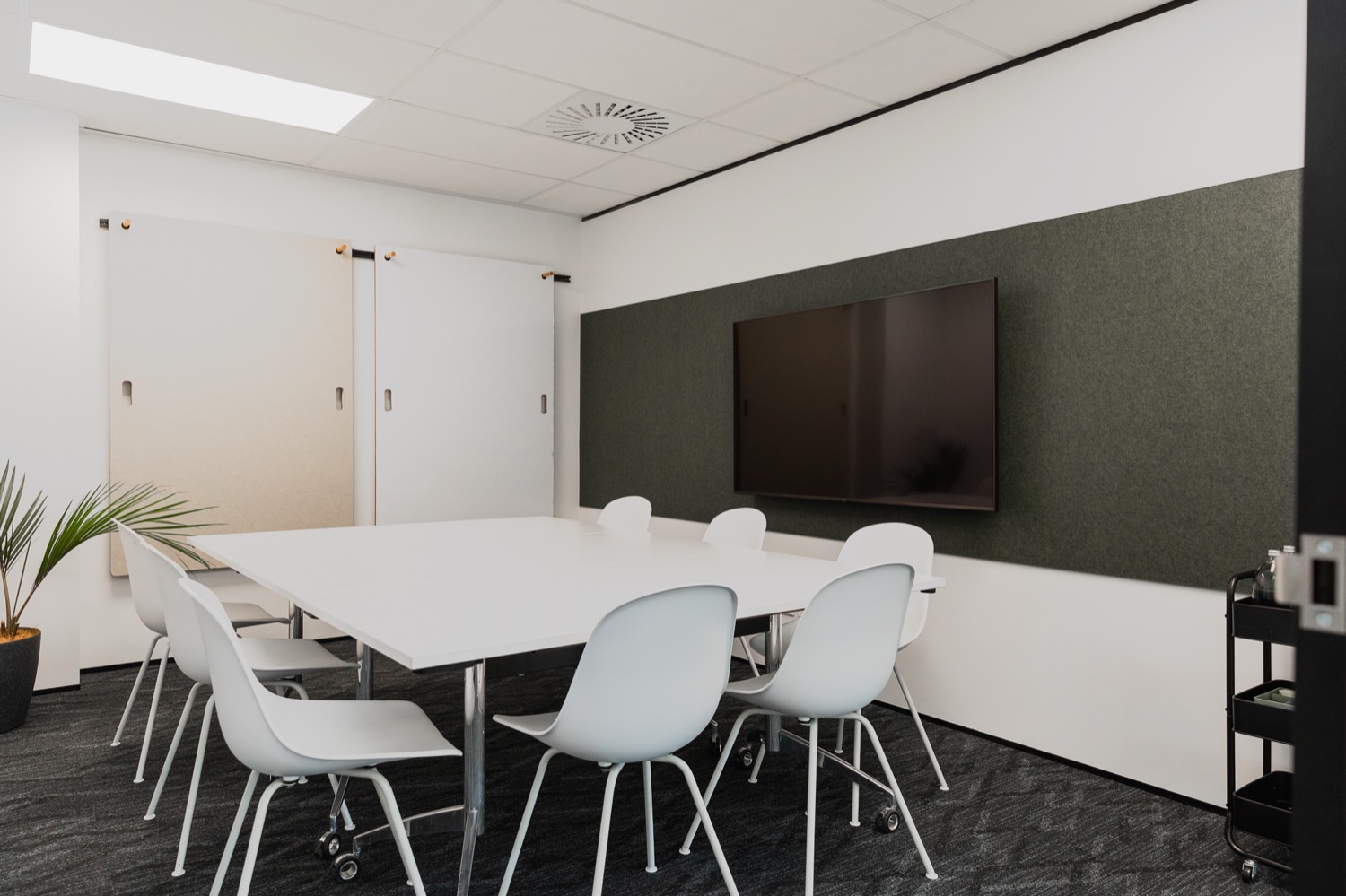 Q Space boardroom with presentation screen
